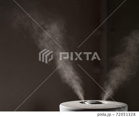 Close-up of steam from an air humidifier in a living room 72051328