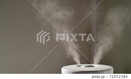 Close-up of steam from an air humidifier in a living room 72052384