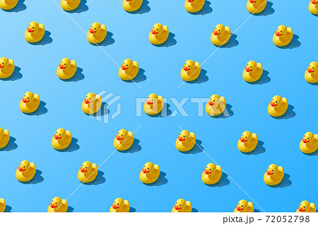 Flat lay of a creative summer yellow rubber duck pattern Flat lay of a creative summer yellow rubber duck pattern 72052798