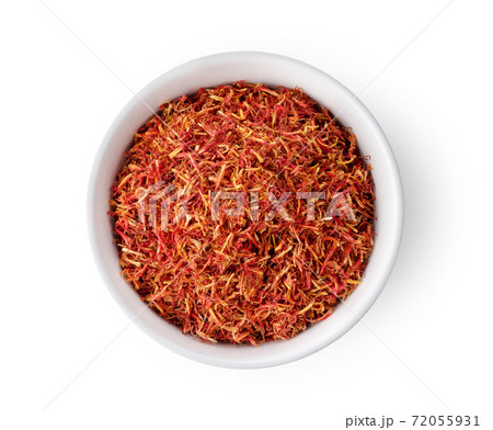 dried safflower in white bowl on white background dried safflower in white bowl on white background 72055931