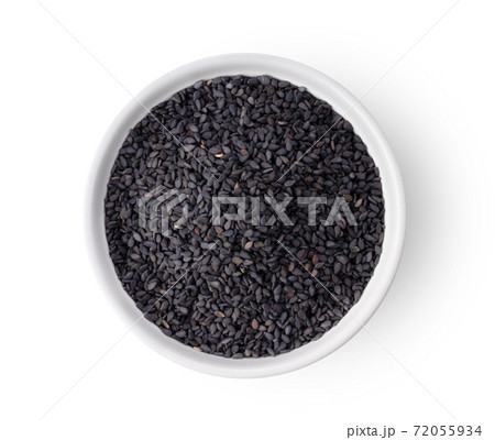 Top view of black sesame seeds in white bowl isolated on white background Top view of black sesame seeds in white bowl isolated on white background 72055934