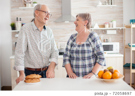 Senior couple smiling at each other 72058697
