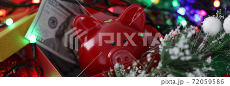 Christmas decoration gift box with red piggy bank and one hundred dollar bills. Christmas decoration gift box with red piggy bank and one hundred dollar bills. 72059586