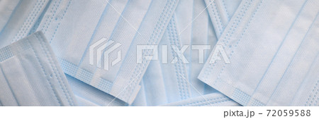 Protective medical masks are on table closeup Protective medical masks are on table closeup 72059588