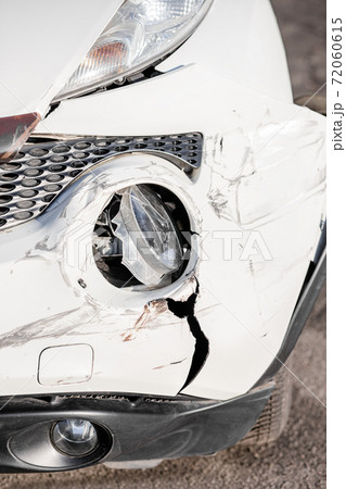 Car accident or accident. The front wing and the right headlight are broken, damage and scratches on the bumper. Broken car parts or close-up. 72060615