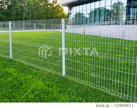 grating wire industrial fence panels, pvc metal fence panel and neatly trimmed lawn. grating wire industrial fence panels, pvc metal fence panel and neatly trimmed lawn. 72060921