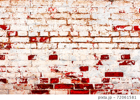 Texture of a brick wall with cracks and scratches which can be used as a background Texture of a brick wall with cracks and scratches which can be used as a background 72061581