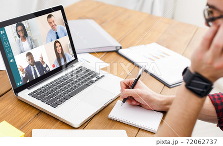 Man having video conference with team while working from home 72062737
