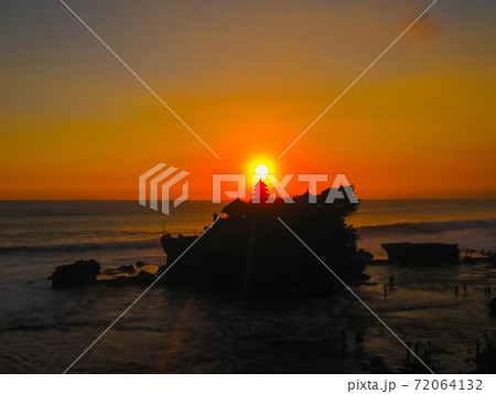 Tanah Lot and sea waves in golden sunset, Bali Tanah Lot and sea waves in golden sunset, Bali 72064132