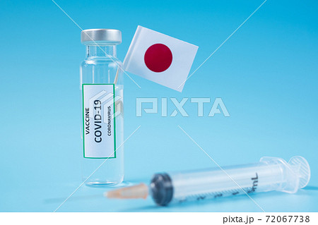 COVID-19 Vaccine vial, injection Needle Syringe and Japanese flag against Coronavirus infection in hospital laboratory. Medical, health, Vaccination and immunization concept 72067738