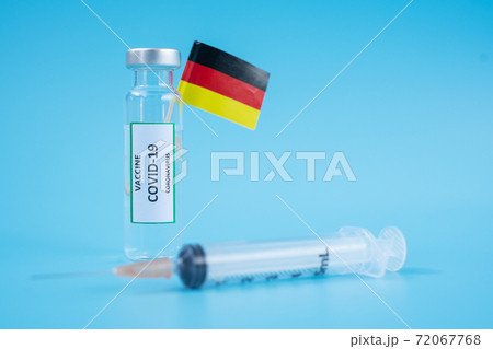 COVID-19 Vaccine vial, injection Needle Syringe and German flag against Coronavirus infection in hospital laboratory. Medical, health, Vaccination and immunization concept COVID-19 Vaccine vial, injection Needle Syringe and German flag against Coronavirus infection in hospital laboratory. Medical, health, Vaccination and immunization concept 72067768