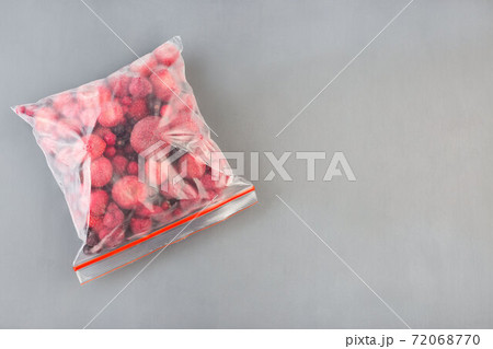 Frozen berries in the plastic bage, raspberry, strawberry, cranberry and black currant, horizontal, copy space, top view Frozen berries in the plastic bage, raspberry, strawberry, cranberry and black currant, horizontal, copy space, top view 72068770