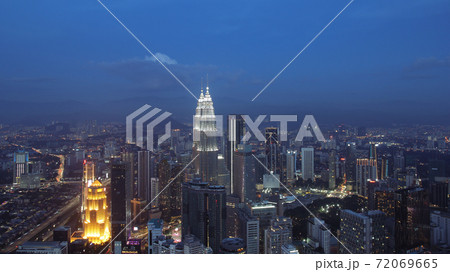 Petronas Towers, colorful vibrant twilight after sunset. Petronas Towers, colorful vibrant twilight after sunset. 72069665