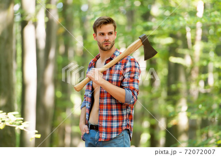sexy male woodcutter hold axe in hands, forest life sexy male woodcutter hold axe in hands, forest life 72072007