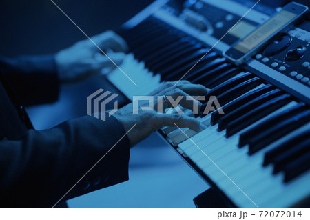 Playing on a synthesizer Playing on a synthesizer 72072014