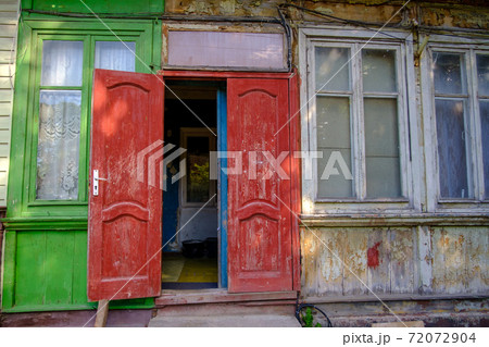 Old house with open door 72072904