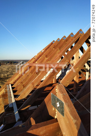exposing the rafters to the background of the blue sky 72074249