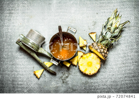 Pineapple jam with a manual juicer. Pineapple jam with a manual juicer. 72074841