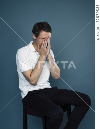 young goofy man with pimples pointing gesturing in studio, stupid bookwarm little crazy, lifestyle people concept 72079383