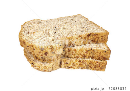 Slice of a whole wheat bread isolated on a white background Slice of a whole wheat bread isolated on a white background 72083035