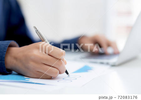 Hand of business man pointing document data graph and chart with pen, marketing and investment. Hand of business man pointing document data graph and chart with pen, marketing and investment. 72083176