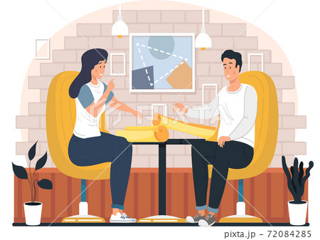 Young people discuss the strategy of doing business. Man and woman talking about a paper project 72084285