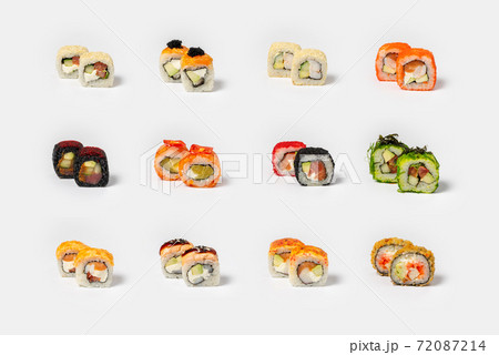 Large set of different types of maki sushi on a neutral light background Large set of different types of maki sushi on a neutral light background 72087214
