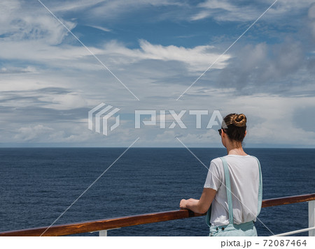 Fashionable woman on the empty deck of a cruise liner Fashionable woman on the empty deck of a cruise liner 72087464