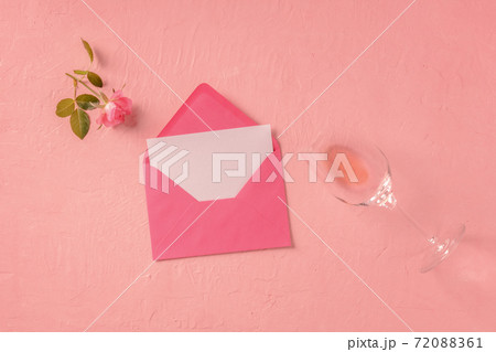 Romantic card or invitation mock up, an overhead flat lay shot with a pink rose and rose wine Romantic card or invitation mock up, an overhead flat lay shot with a pink rose and rose wine 72088361
