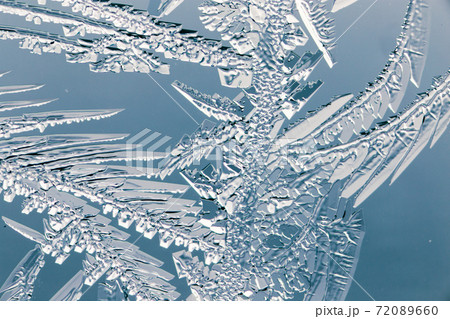 Snow patterns on glass as an abstract background 72089660
