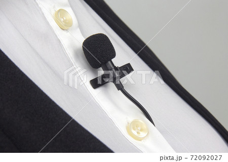 clip-on lavalier microphone is attached to women's clothing close-up. 72092027