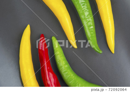 yellow, red and green hot chili on a plate. Pepper. Vegetable vitamin food. yellow, red and green hot chili on a plate. Pepper. Vegetable vitamin food. 72092064