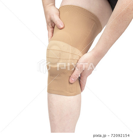 bandage for fixing the injured knee of the human leg on a white background. medicine and sports. 72092154