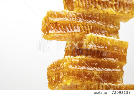 pieces of beeswax honey on a white background 72092188