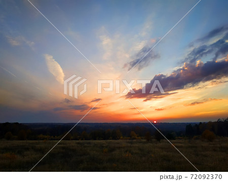 Unbeatable sky on the fall day during the sunset somewhere far away in the field 72092370