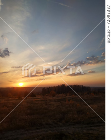 This is how the sun sets in the field in the late autumn of the year 72092387