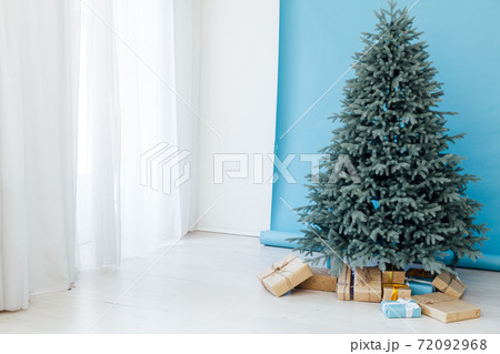 Red decor new year interior Christmas tree with gifts 72092968