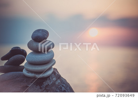 Stones pyramid on sand symbolizing zen, harmony, Stones pyramid on sand symbolizing zen, harmony, 72093649
