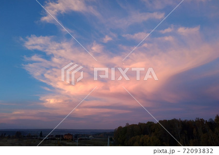 A fantastically dramatic sky against the background of the autumn field 72093832