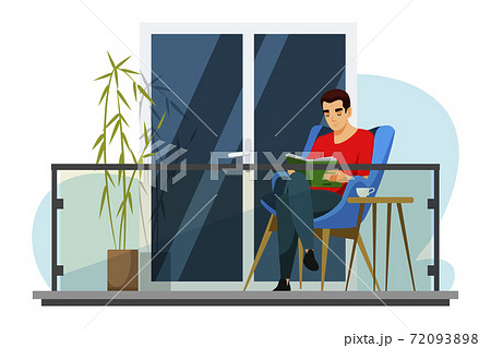 Man is reading book on balcony of his house 72093898