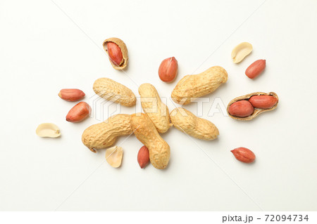 Tasty peanuts on white background, top view Tasty peanuts on white background, top view 72094734