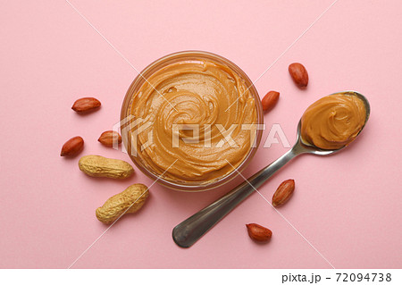 Peanut, bowl and spoon with peanut butter on pink background Peanut, bowl and spoon with peanut butter on pink background 72094738