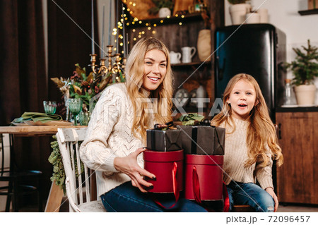 Christmas morning in our home . Happy family with Christmas gifts Christmas morning in our home . Happy family with Christmas gifts 72096457
