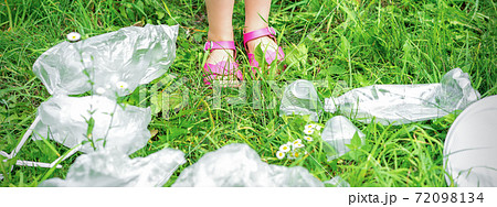 Plastic bags lying on grass Plastic bags lying on grass 72098134