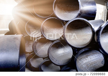 Black metal pipes and adapters of different diameters for gasification or water supply. Industrial background Black metal pipes and adapters of different diameters for gasification or water supply. Industrial background 72099660