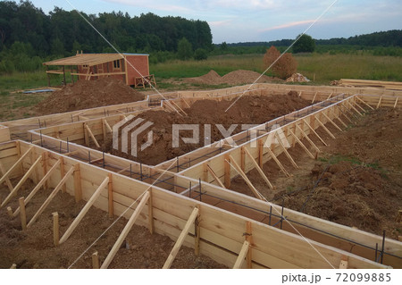 Wooden formwork concrete strip foundation for a cottage 72099885