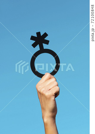 person showing a non-binary gender symbol 72100848