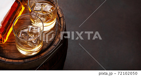 Scotch whiskey bottle, glasses and old barrel Scotch whiskey bottle, glasses and old barrel 72102050
