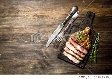 Beef grill with spices on a cutting Board. Beef grill with spices on a cutting Board. 72103540