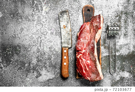 piece of raw beef. 72103677